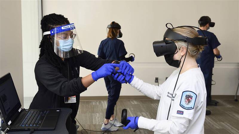 Nurses in training wear AR googles to practice medical procedures.