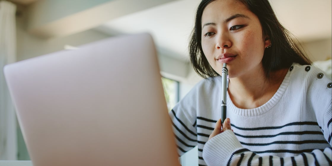 Close up of student focused on laptop for online learning
