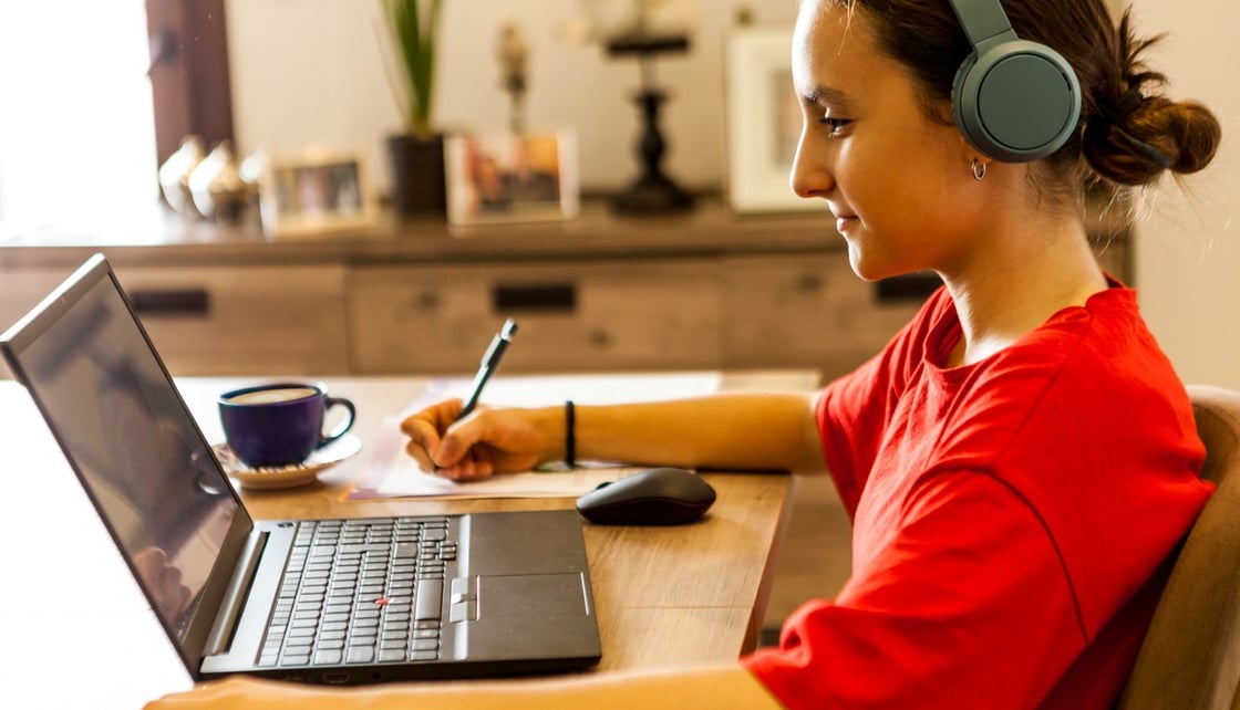 Woman working on laptop on a video scenario